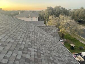 completed asphalt shingle roof replacement on a residential house in Hutto TX